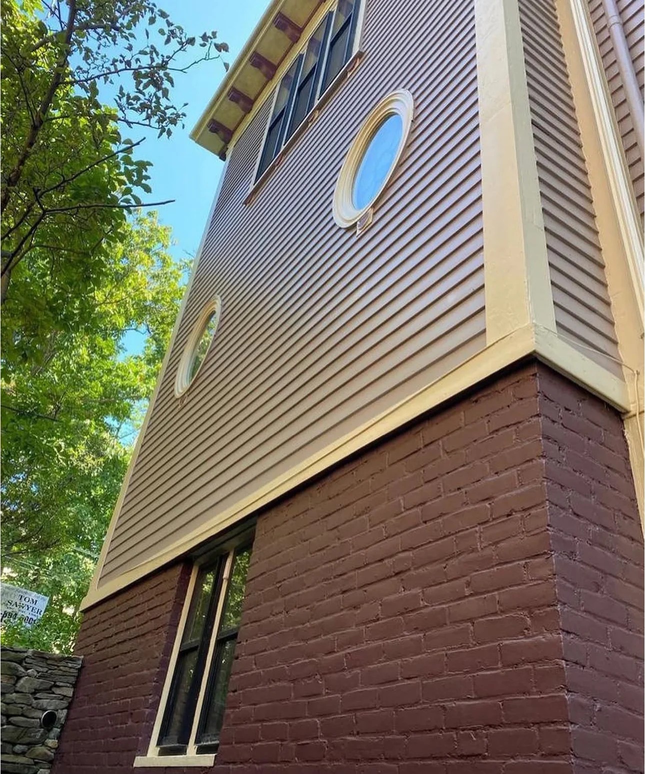 Exterior siding, brick and trim repainted on a Boston home